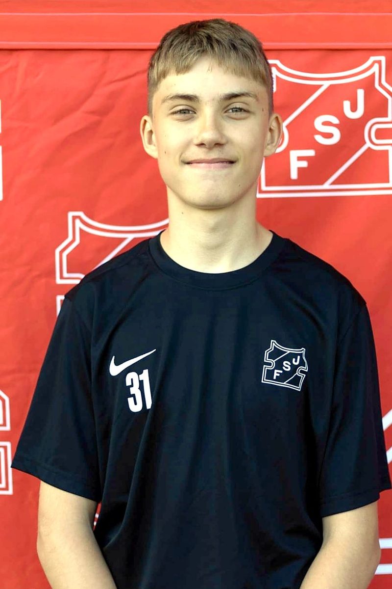 Portrait of Aleksandr Dauber in the black #31 Jūrmala FS shirt